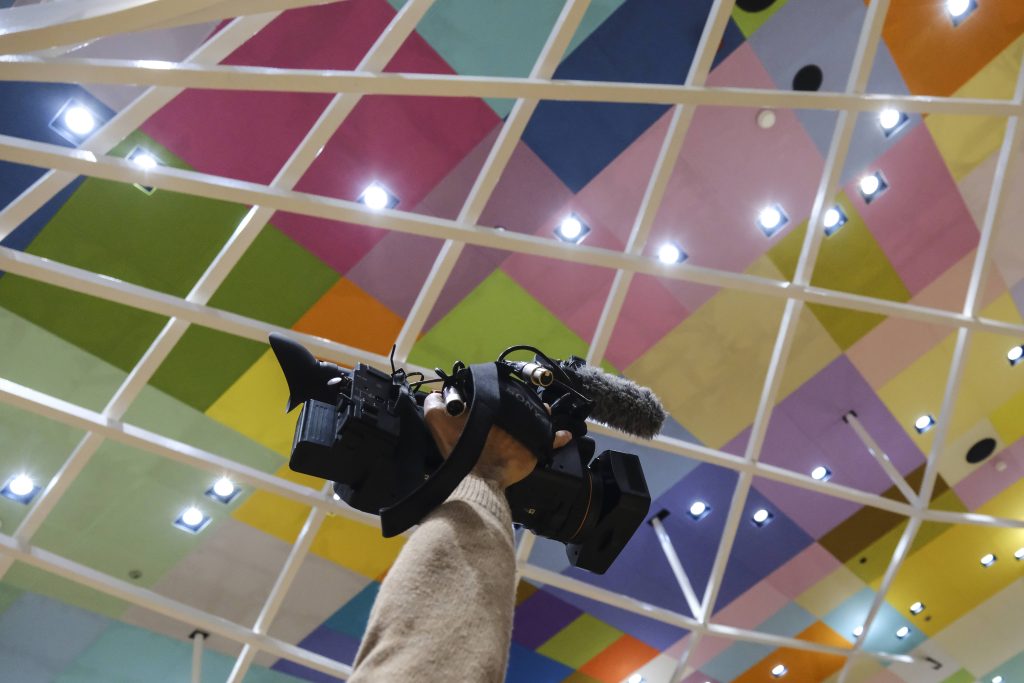 Cameraman holding camera in the Council of the EU